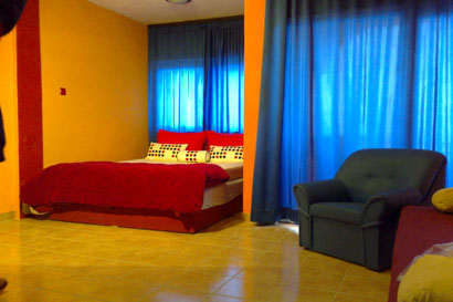 One double bed is situated in living room,but as you can see it has special position in the corner and does not affect on daily movements in living room.